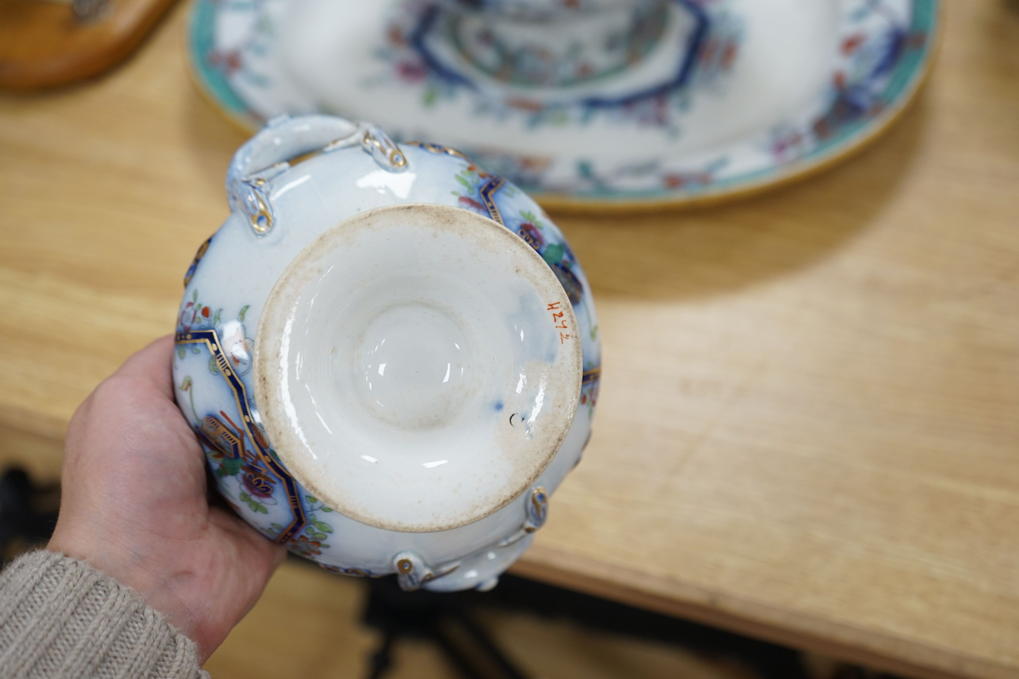 A mid 19th century Staffordshire pottery lidded soup tureen and cover (base cracked), a large meat dish and a sauce tureen (lacking lid) (3)